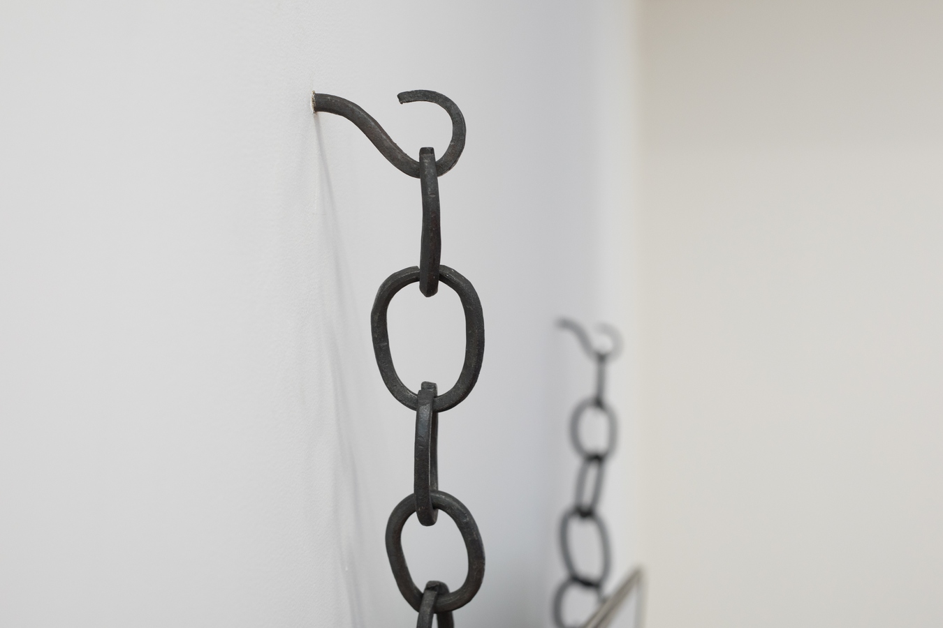 Image: Isabel Wadeson-Lee, <em>In the void between fire and fire</em> (detail), forged steel, rayon and video, 2021. Components on loan from the Macmillan Brown Library, University of Canterbury. Photo: Janneth Gil.